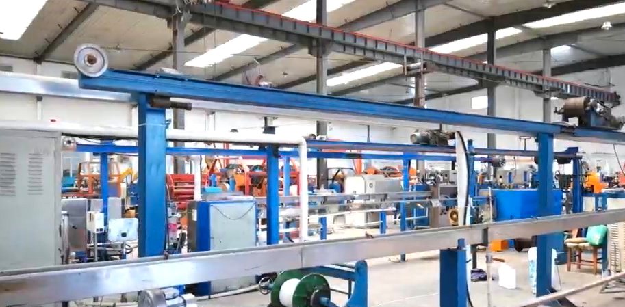 Insulation extrusion line with haul-off and cooling trough