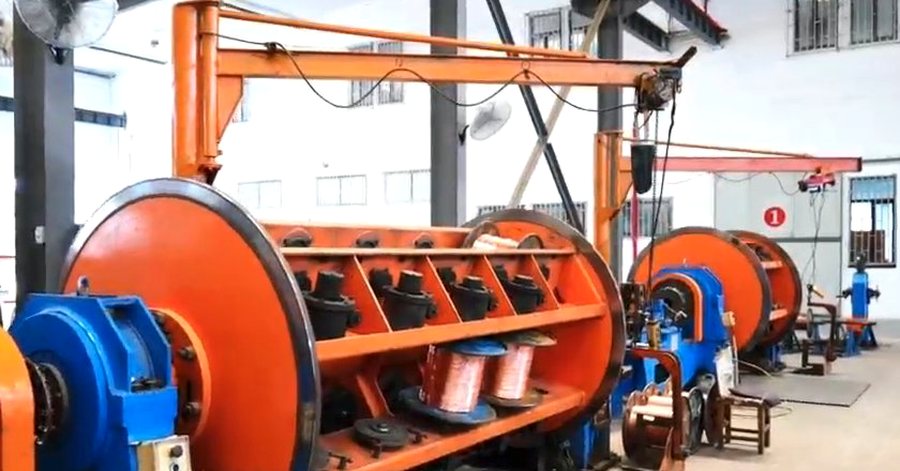 Cage strander winding copper wires into a stranded conductor on the production floor